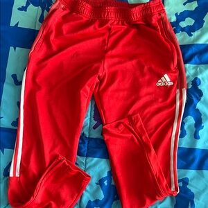 Adidas Men’s Red Joggers with White Stripes.